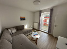 Wohnzimmer mit Zugang zur Terrasse